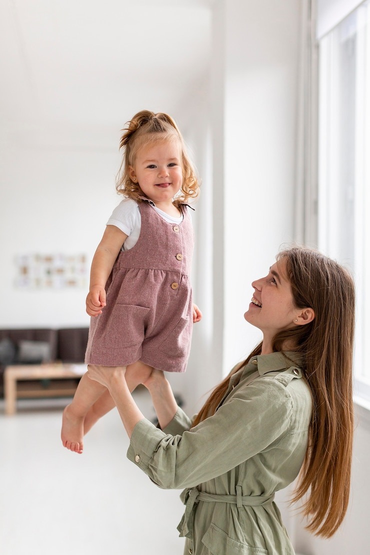 Parent holding child while looking for a babysitter